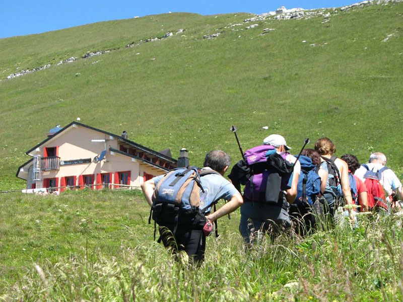 Hikers at Dal Piaz Mountain Hut