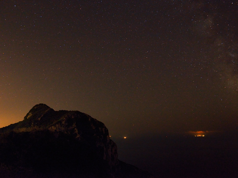 The promontory under the stars and the Pontine Islands on the background